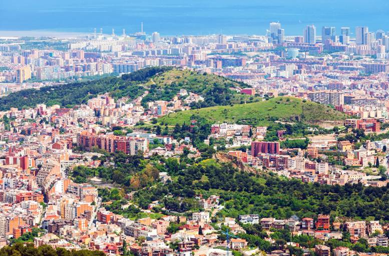 Aerial view of Barcelona’s residential districts and urban skyline along the Mediterranean coast