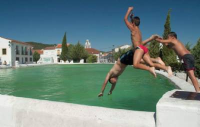 Residents swim to the town hall or to church