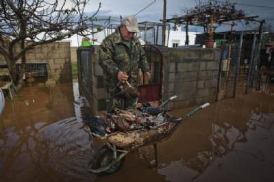 Flash floods leave woman dead, numerous homes evacuated and drivers trapped in their cars