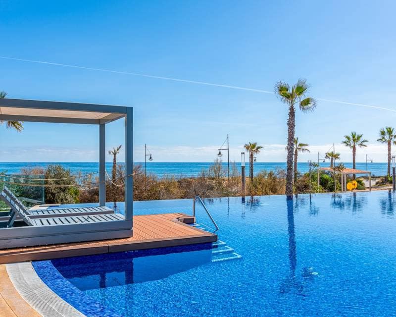 2 bedroom Beach Apartment for sale in Punta Prima with pool garage - € 420,000 (Ref: 9301418)