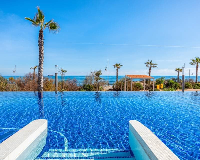 2 bedroom Beach Apartment for sale in Punta Prima with pool garage - € 420,000 (Ref: 9301418)