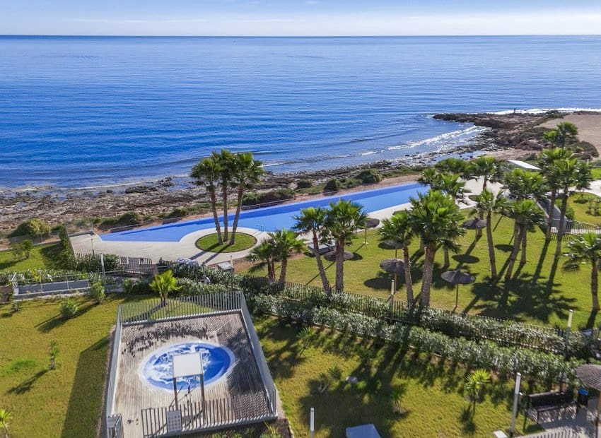 2 bedroom Beach Apartment for sale in Punta Prima with pool - € 460,000 (Ref: 9397014)