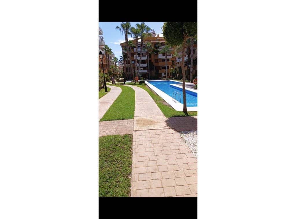 2 slaapkamer Strandappartement te huur in Orihuela Costa met zwembad garage - € 1.000 (Ref: 9211694)