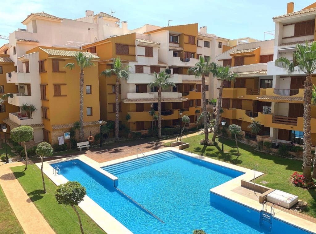 2 slaapkamer Strandappartement te huur in Orihuela Costa met zwembad garage - € 1.000 (Ref: 9211694)