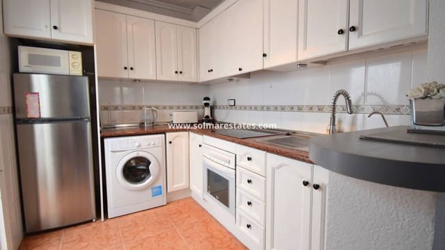 2 quarto Moradia Geminada para venda em Playa Flamenca, Orihuela com piscina - 180 000 € (Ref: 10073001)